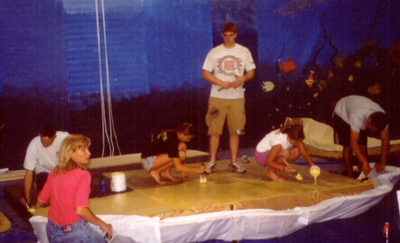 Working hard painting the clam