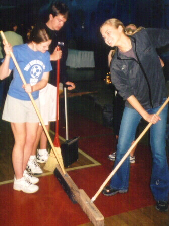 Having fun sweeping up!